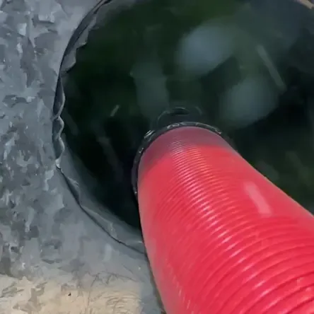 Professional air duct and AC cleaning equipment clearing debris from a Boca Raton ventilation duct