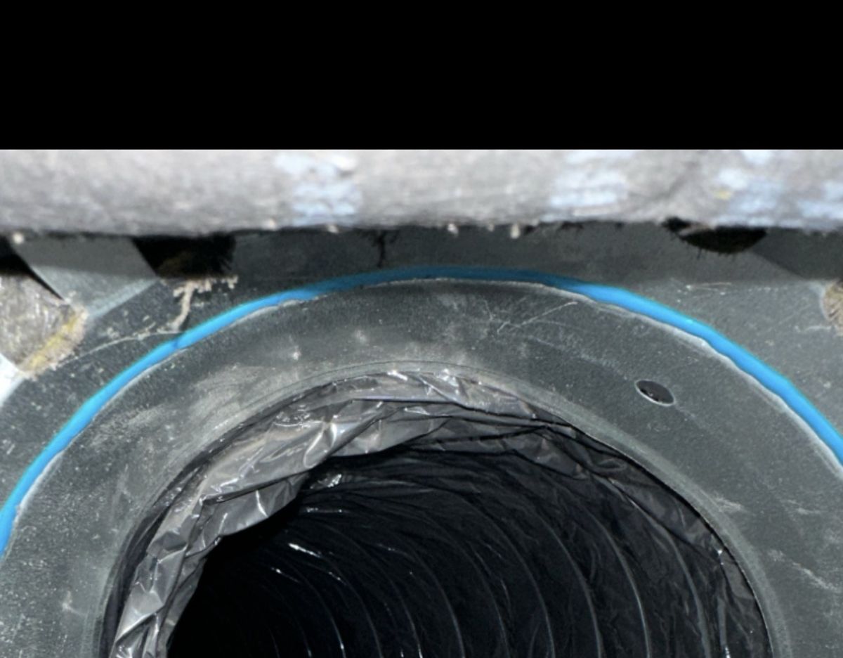 Dark flex duct before professional cleaning